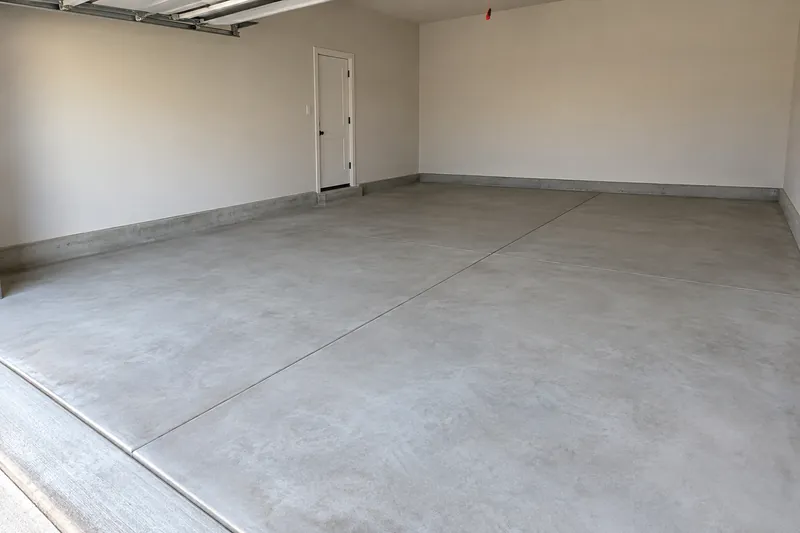 Smooth new concrete floor in an empty two-car garage