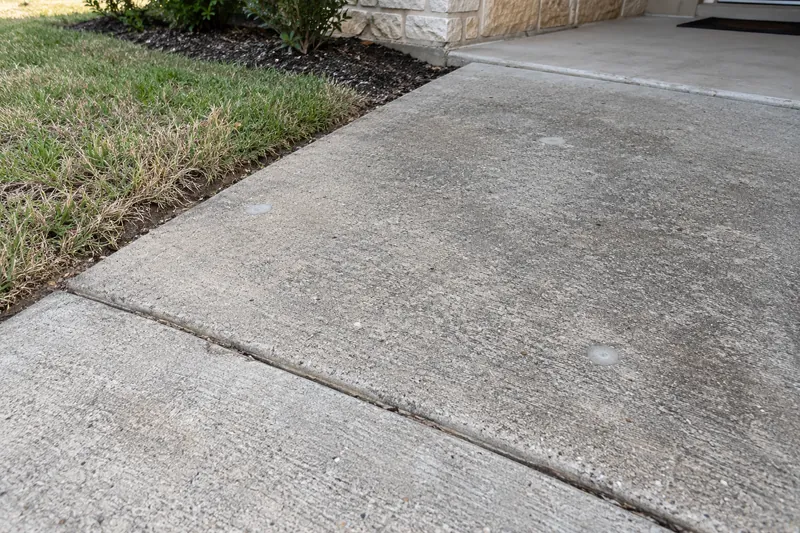 Leveled walkway panel showing small patched injection holes