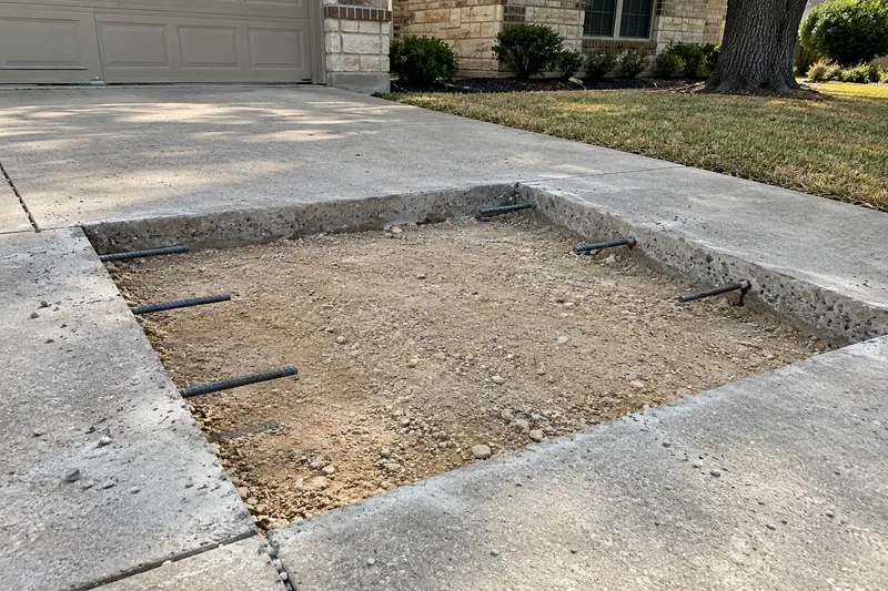 Sawn-out driveway panel with dowel bars drilled into the edges