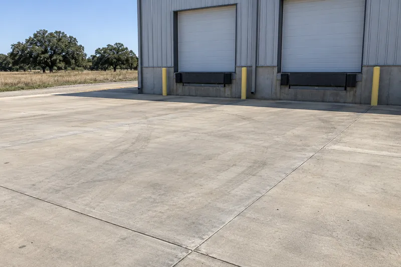 Jointed concrete truck apron in front of loading dock doors
